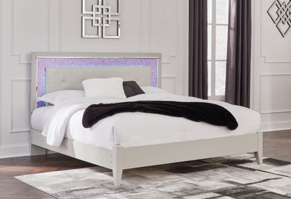 Zyniden King Upholstered Panel Bed, Dresser, Mirror and Nightstand