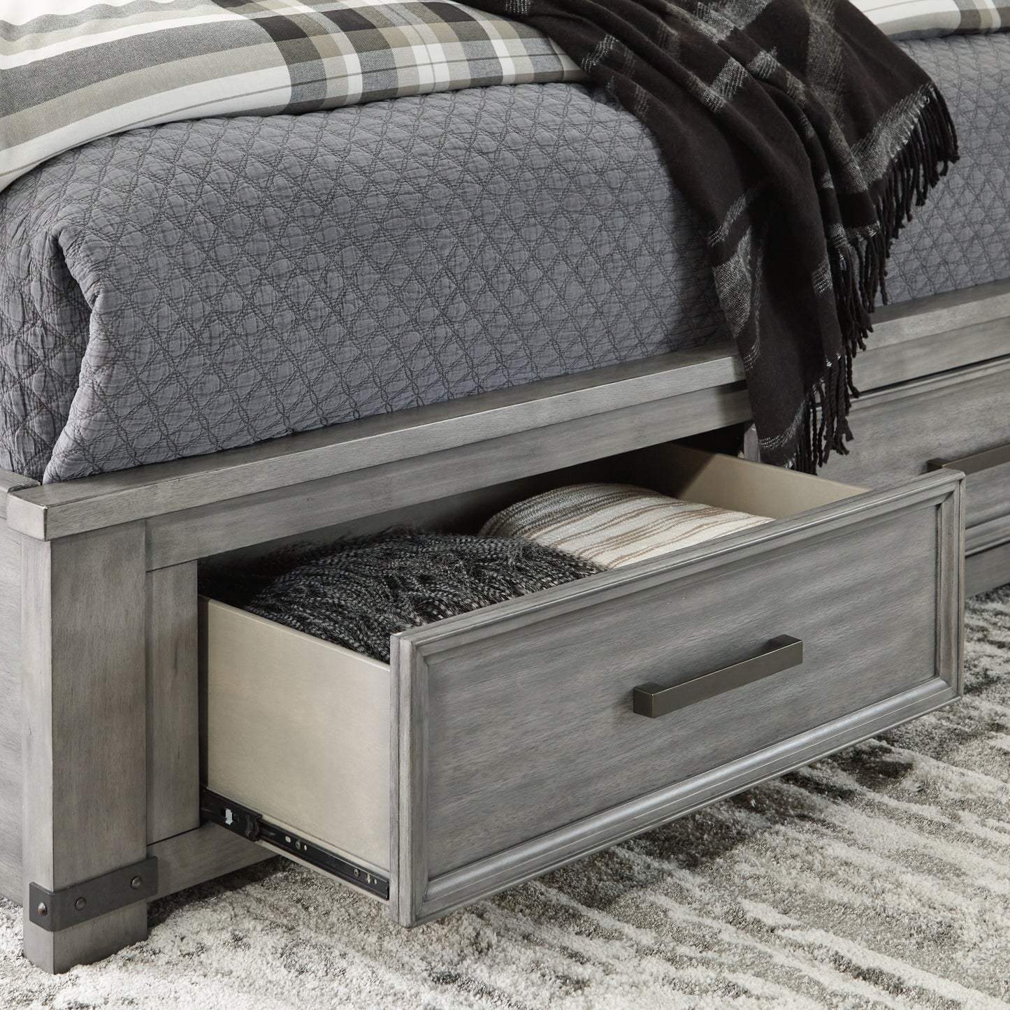 Russelyn Queen Panel Storage Bed, Dresser, Mirror and Nightstand